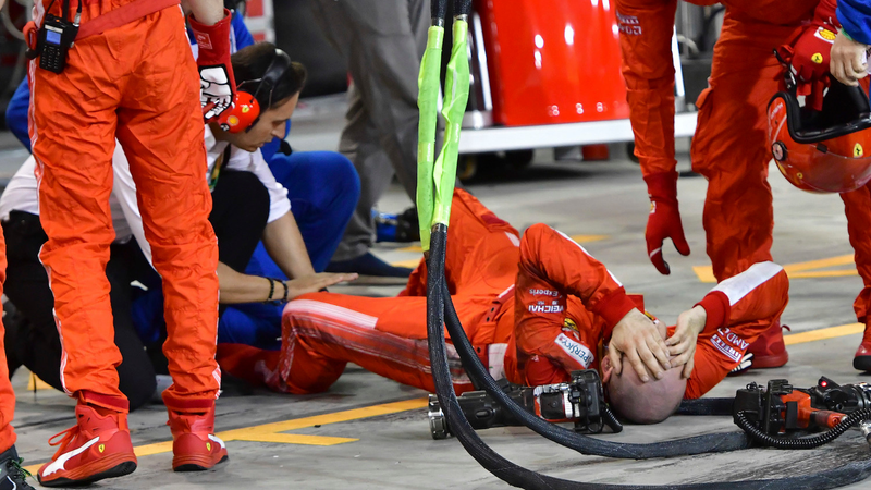 The mechanic on pit lane after being hit by the car.
